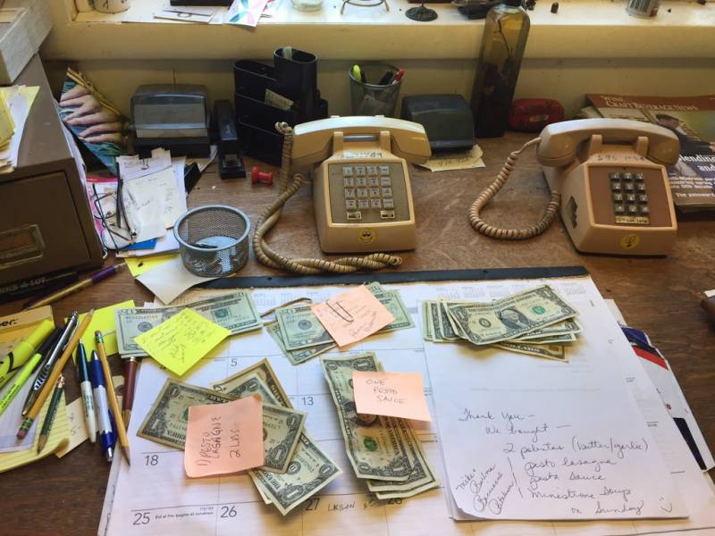 Piles of cash on the desk of the Pasta King at his Cotati kitchen.