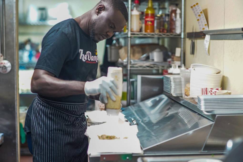 Oumar Diouf in the kitchen of his restaurant, The Damel, in downtown Oakland.