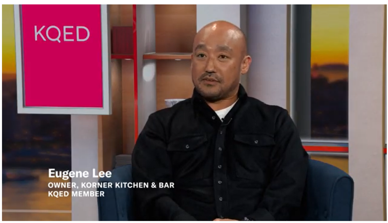 Screenshot of YouTube video with a man seated in a studio with text that reads Eugene Lee, Owner, Korner Kitchen & Bar, KQED Member