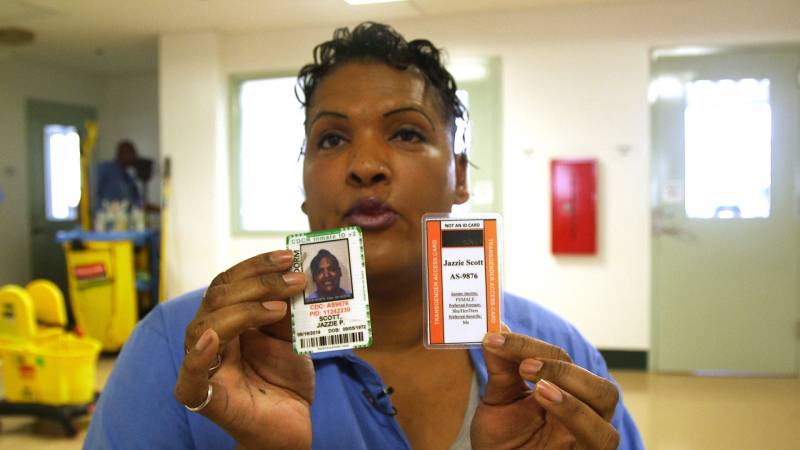 Jazzie Paradize Scott displays her transgender ID card, issued by the California Department of Corrections and Rehabilitation. The CDCR has designated certain prisons as hubs for transgender inmates, where support services and resources can be clustered.