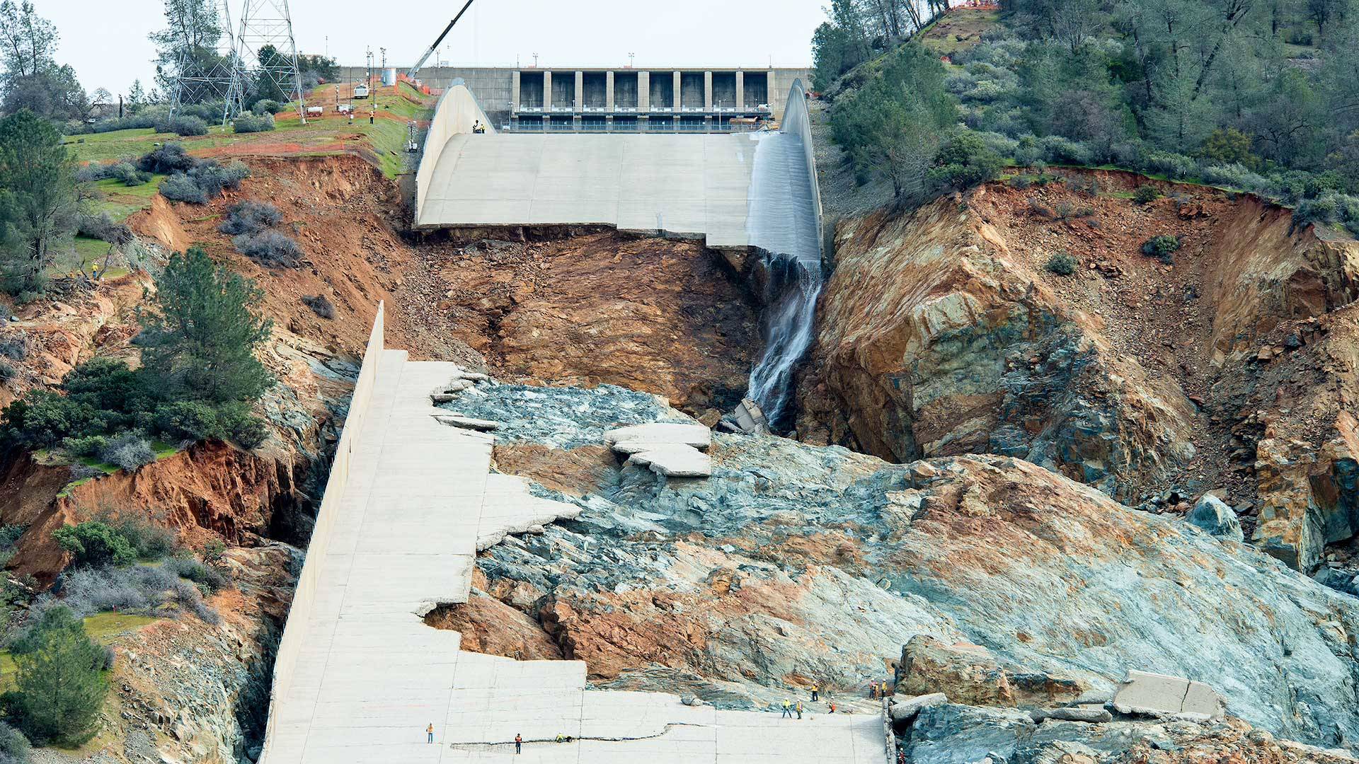 Ruins of the main spillway at Oroville Dam reveal a blend of "fresh" (blue-gray) rock and "weathered" (reddish-brown) rock underneath. Calif. Dept. of Water Resources
