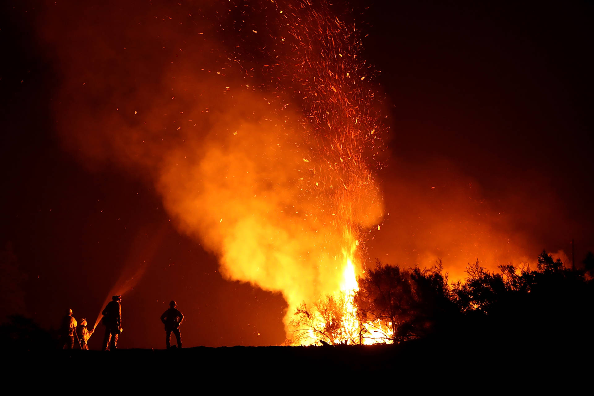 Cal Fire firefighters monitor a back fire as they battle the Medocino Complex fire on August 7, 2018 near Lodoga, California. 

  Justin Sullivan/Getty Images