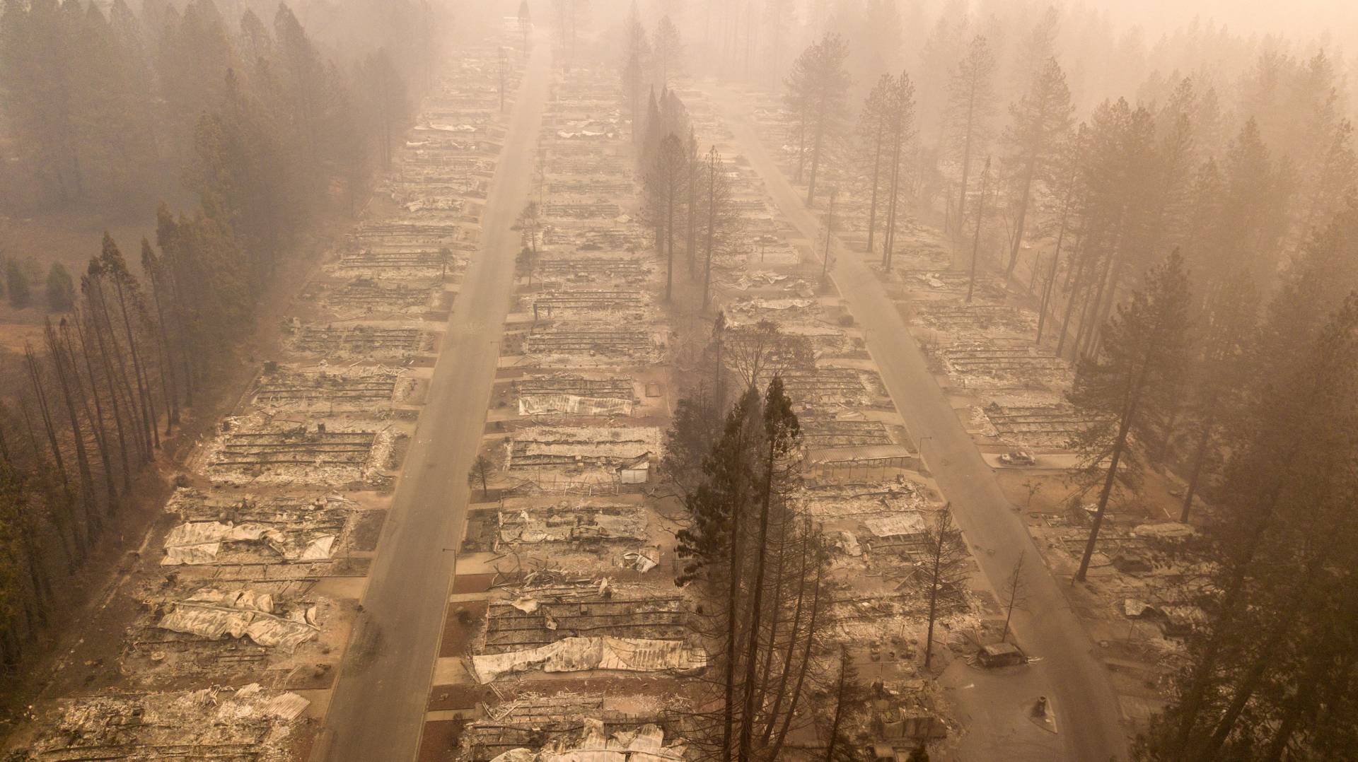 The Camp Fire consumed entire neighborhoods in Paradise, California. A massive federal report says climate change is contributing to larger wildfires as well as other deadly extreme weather. JOSH EDELSON/AFP/Getty Images