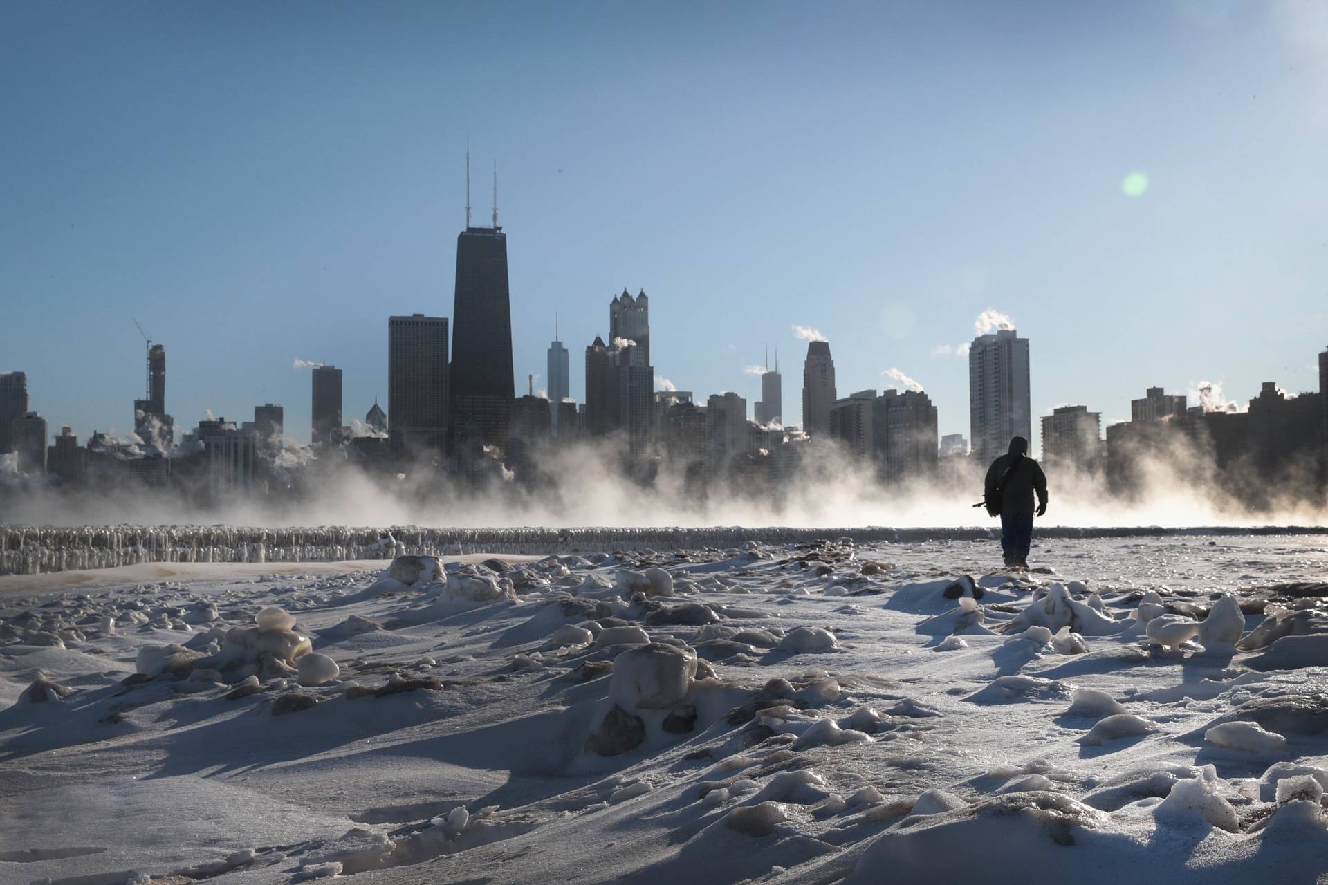 A man walks along the lakefront as temperatures hovered around -20 degrees on Jan. 30, 2019 in Chicago, Scott Olson/Getty Images