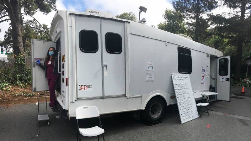 Nurse Ana Mota at the Opiate Treatment Outpatient Program (OTOP) mobile van at Zuckerberg San Francisco General Hospital. Since March, medical staff have treated many methadone patients outside to allow for social distancing.