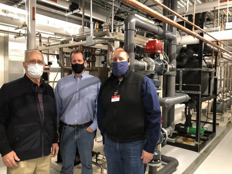(Left to right) Ed Estberg, Mark Koppang, and Nathan Smith in the machine room of the Raley's on Freeport Boulevard in Sacramento. Carbon dioxide removes heat from the products on the floor of the store, and then ammonia, which is only in the machine room, removes that heat from the carbon dioxide. The heat is discharged as steam or warm air from the roof of the store.