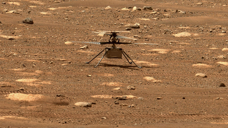 The Mars Helicopter, Ingenuity, resting on the ground on Mars, awaiting its first historic flight on another world.  NASA/JPL-Caltech