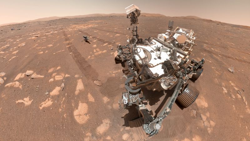 A "selfie" taken by NASA's Perseverance rover, including the Mars Helicopter Ingenuity resting between the rover's tracks where it was placed on the ground in preparation for test flights.  NASA/JPL-Caltech