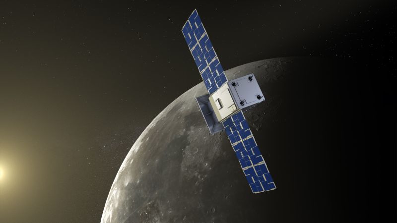 Artist illustration showing a square white box with large, flat, rectangular blades attached at one side. This cubesat approaches a round grey surface, with the edge of the sun off to the left of the image.