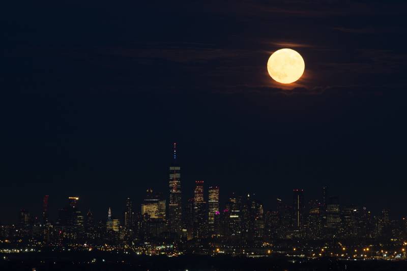 The last supermoon of the year rises over Lower Manhattan of New York City, United States on August 11, 2022. (Photo by Tayfun Coskun/Anadolu Agency via Getty Images)