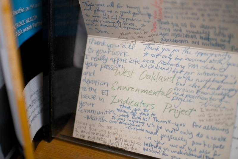 The image is of the inside of a card with many handwritten notes thinking the West Oakland Environmental Indicators Project and Margaret Gordon for her work on environmental justice.