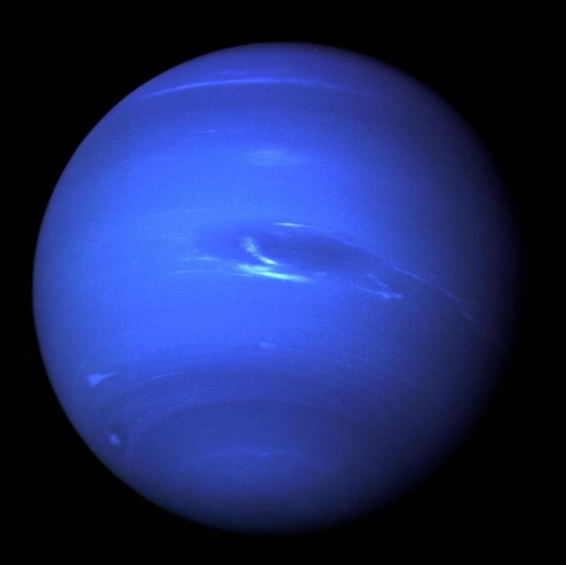 This picture of Neptune was taken by Voyager 2 less than five days before the probe's closest approach of the planet on Aug. 25, 1989. The picture shows the "Great Dark Spot" — a storm in Neptune's atmosphere — and the bright, light-blue smudge of clouds that accompanies the storm.
