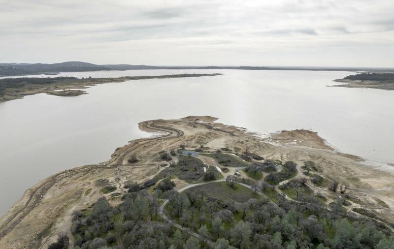 Image shows lake level conditions surrounding Granite Bay Main Beach at Folsom Lake in Placer County, California.
