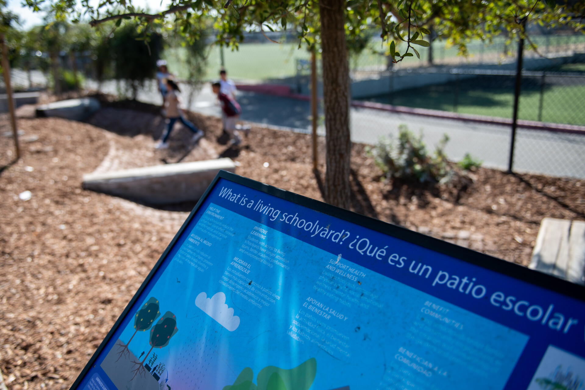A display in both English and Spanish on the schoolyard.