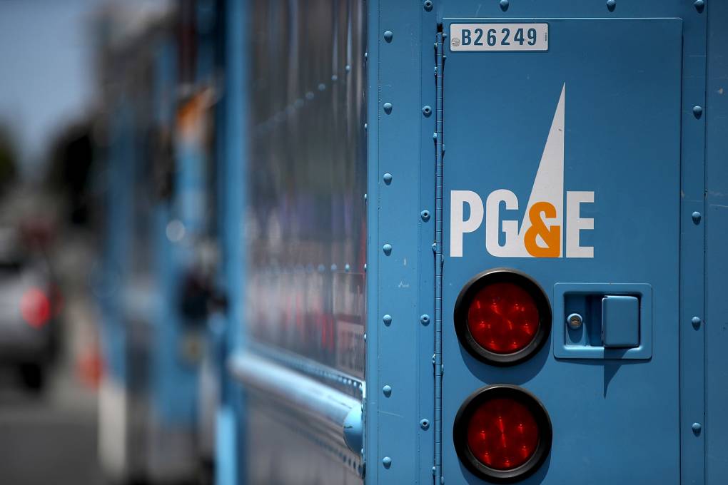 The back of a blue PG&E truck is seen.