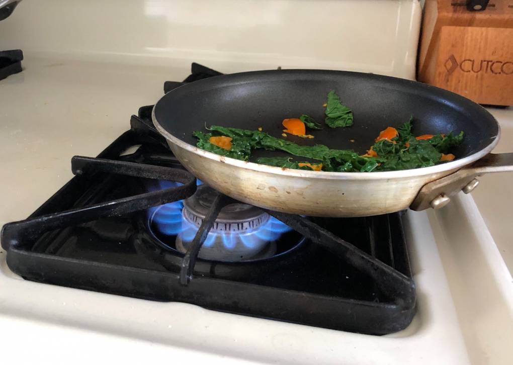 frying pan over gas burner