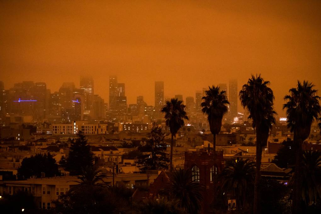 A view of the San Francisco skyline from Dolores Park in San Francisco on Sept. 9, 2020. Smoke in the atmosphere gave the sky an orange tint. Beth LaBerge/KQED