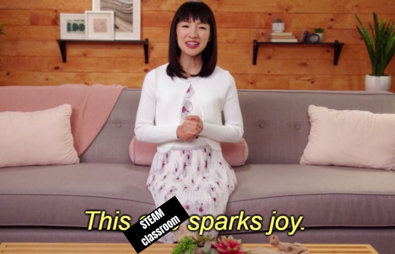 Meme of Marie Kondo sitting on a couch with the caption "This STEAM classroom sparks joy."