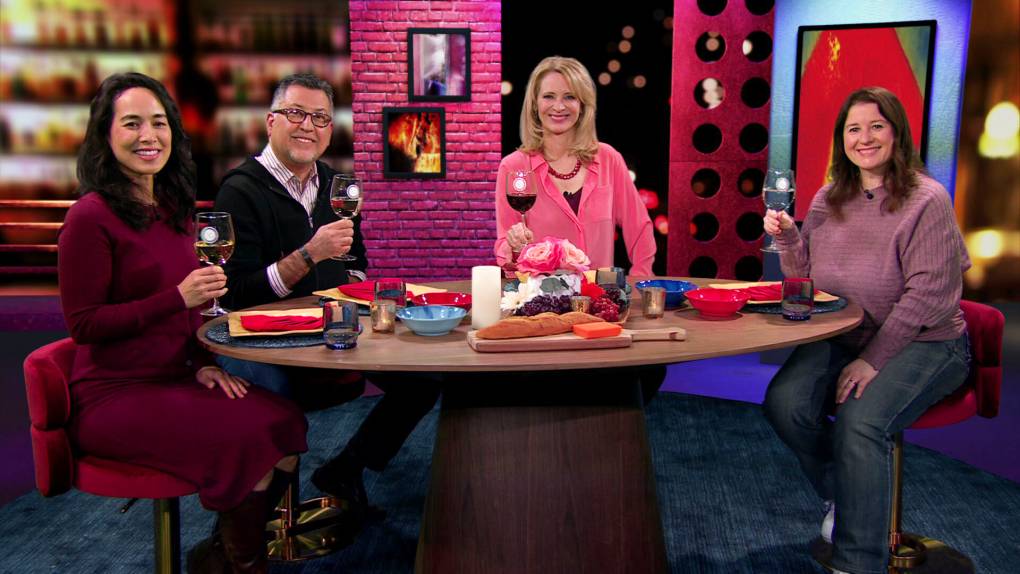 Three Bay Area residents join host Leslie Sbrocco in lifting their wine glasses in a "cheers."