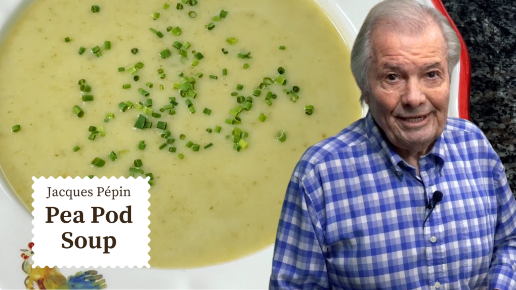 A big bowl of green pea soup with chives in the background. Jacques pepin stands in the foreground in a blue plaid shirt
