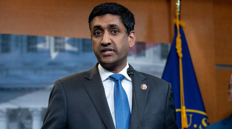 Ro Khanna stands behind podium addressing the press