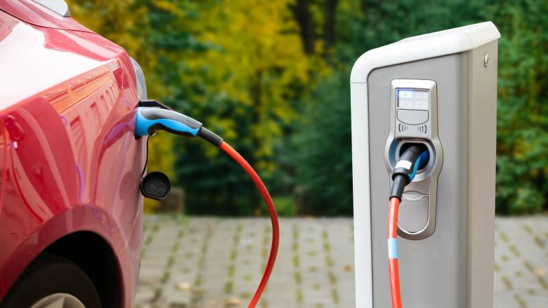 a red electric car charging