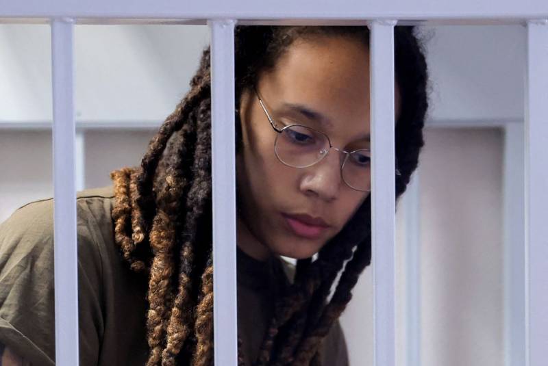 US basketball player Brittney Griner stands in a defendants' cage before a court hearing