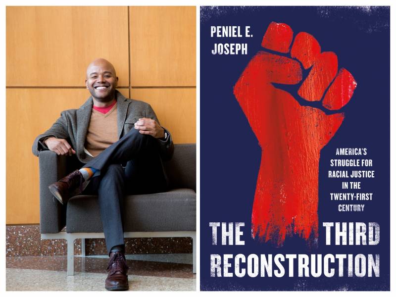 On the left side is a Black man sitting on a couch with his legs crossed and smiling. On the right side is the cover of a book titled, "The Third Reconstruction." The book cover is dark blue and has an illustration of a red raised fist.