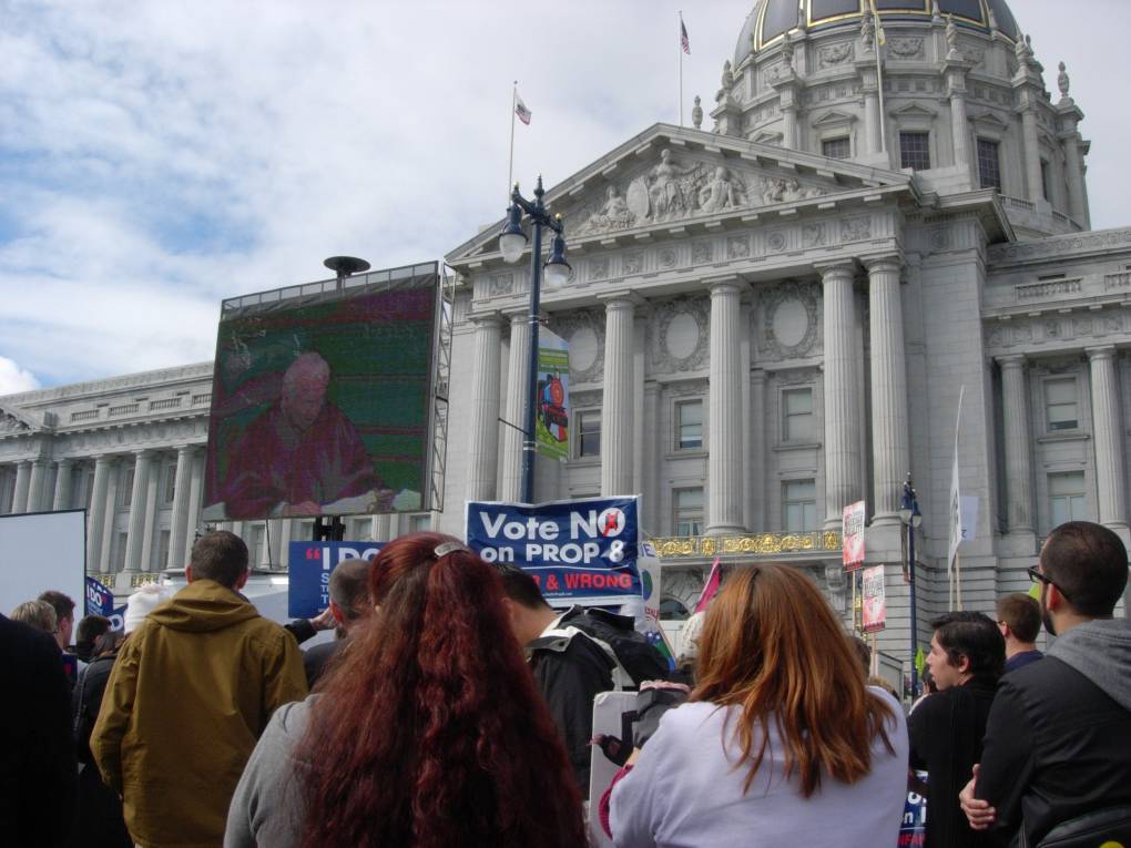 A crowd gathers in front of the California Supreme Court headquarters in San Francisco to watch the Proposition 8 court proceedings on a jumbo screen, on March 5, 2009.