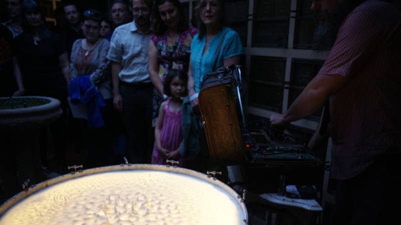 John Benson performs with his milk-covered drum at Garden of Memory in 2016.