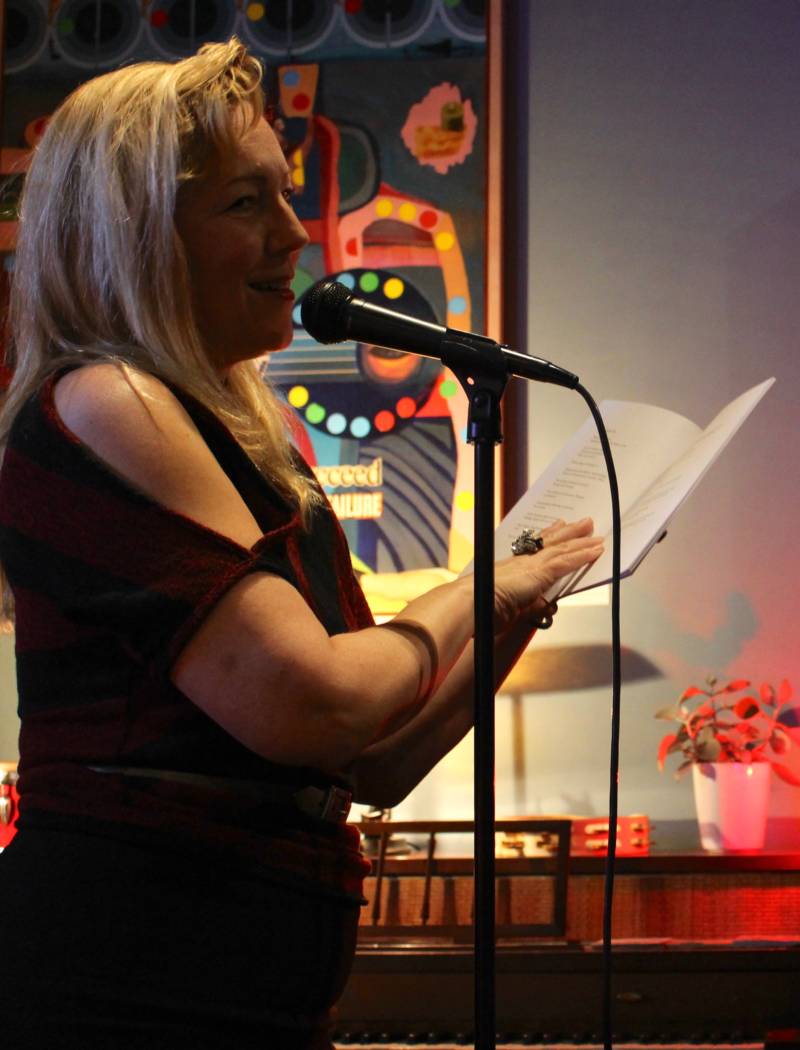 Justine TenZeldam reading during Dirty Old Women at Octopus Literary Salon. 