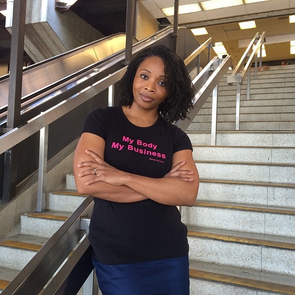 One version of Michele Pred's 'her body her business' shirt being modeled by a friend