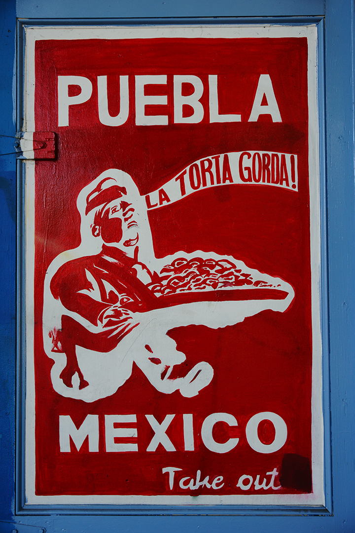 "Puebla Mexico Takeout" sign photographed by Dick Evans. 