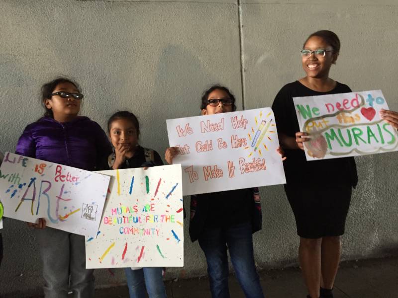 Hoover Elementary 4th graders protest a Caltrans policy holding up a new mural on a Highway 580 underpass