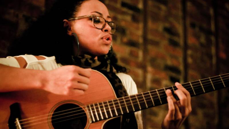 Elle Varner performs at a Sofar Sounds house show in Brooklyn. A new partnership between the house concert company and Airbnb has been criticized for providing musicians exposure but little to no pay.