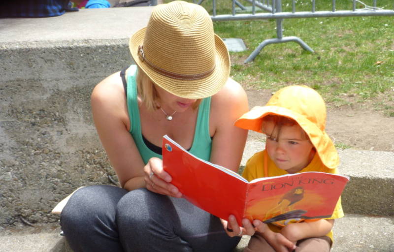 Mom and child reading at last years Bay Area Book Festival