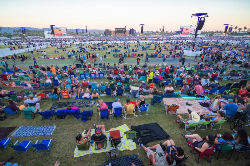 A crowd slowly fills the Polo Fields at Indio for the Desert Trip music festival.