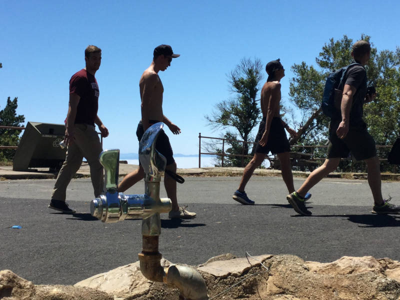 Some dudes walking by a fountain at Mt. Tamalpais