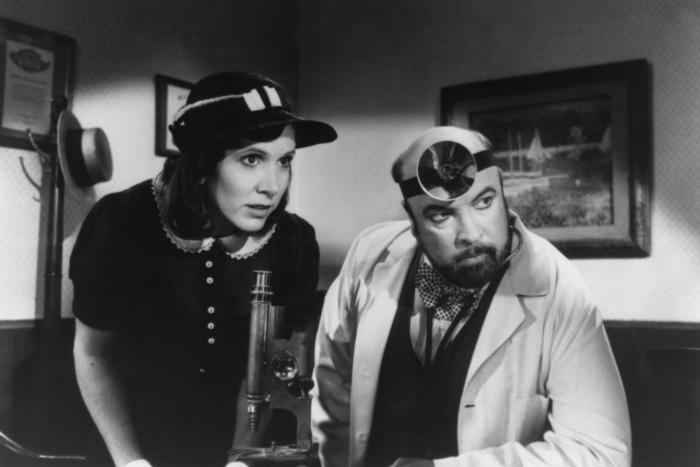 Carrie Fisher and Paul Bartel in 'Amazon Women on the Moon,' 1987.
