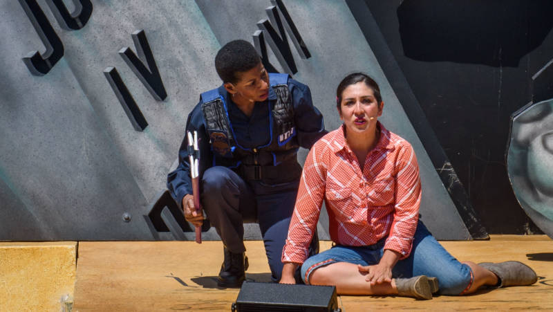 Just depicting L. Mary Jones (Velina Brown) and Zaniyah Nahuati (Marilet Martinez) together is dangerous for Breitbart News in 'Walls' by the San Francisco Mime Troupe.