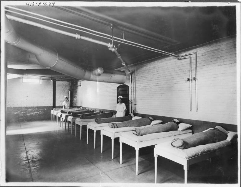 In one hydrotherapy practice, attendants wrap patients in wet sheets and wait for several hours. The photo above was taken circa 1900.
