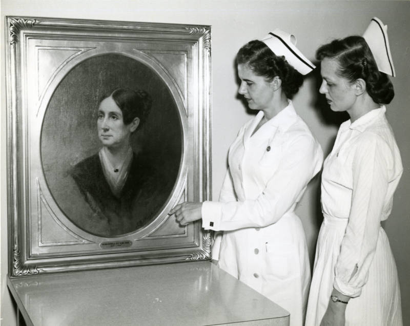 St. Elizabeths nurses in the 1950s study a portrait of Dorothea Lynde Dix, a 19th century social reformer. Dix helped found the treatment facility in the 1850s.
