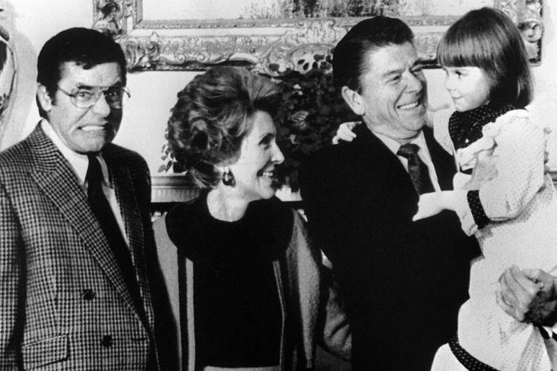 Lewis makes a face in 1981 as President Reagan and his wife, Nancy, receive Christi Bartlett, a child who was suffering from muscular dystrophy.