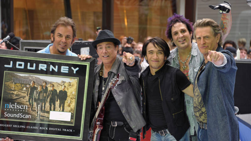 (L-R) keyboard player Jonathan Cain, guitar player Neal Schon, singer Arnel Pineda, drummer Deen Castronovo, and bass player Ross Valory of the band Journey performs at the 2011 Today Summer Concert series at Rockefeller Plaza on July 29, 2011 in New York City. 