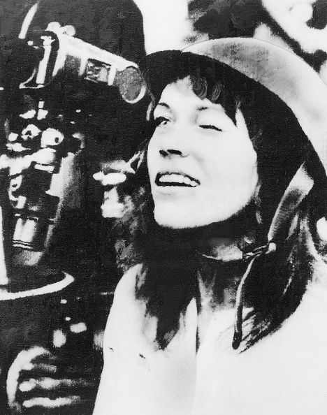 American actress and antiwar activist Jane Fonda looks though the scope of an anti-aircraft gun during her tour of the North Vietnamese capital. She arrived July 8 at the invitation of the Vietnam Committee for Solidarity with the American People.