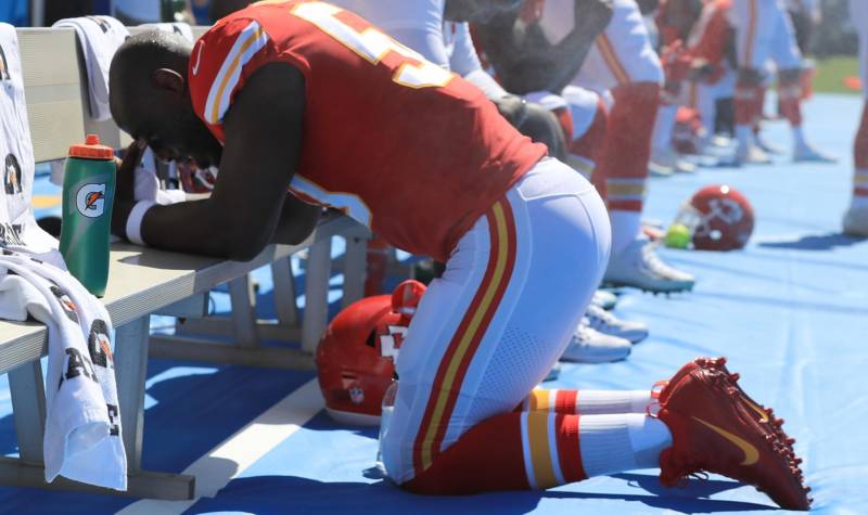 Justin Houston of the Kansas City Chiefs takes a knee during the National Anthem before a game against the Los Angeles Chargers, Sept. 24, 2017 in Carson, California. 