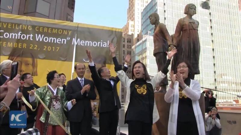 Lillian Sing and Julie Tang celebrate the unveiling of the 'Column of Strength'