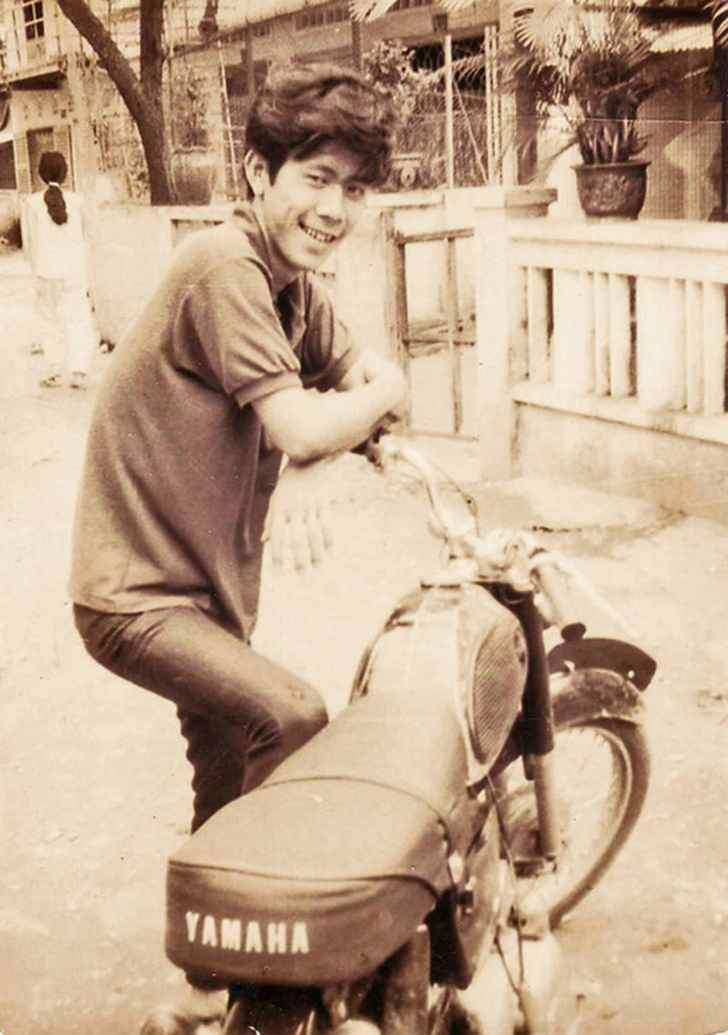 Nguyen's dad with a motorcycle in Vietnam
