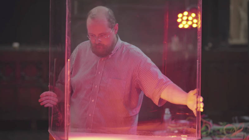 Dan Deacon positions a plexiglass case used to hold rats for the 'Rat Film' score.