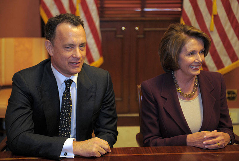 Nancy Pelosi sits with Tom Hanks during a photo-op in her private conference room at the Capitol on March 5, 2008 in Washington, DC. 